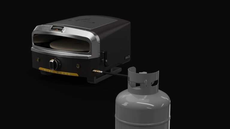 Outdoor pizza oven with a propane tank attached