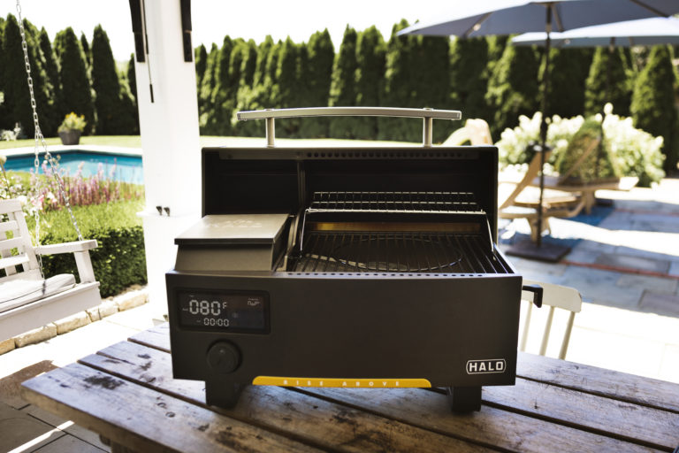 Prime300 Countertop Pellet Grill on a dining table in a backyard