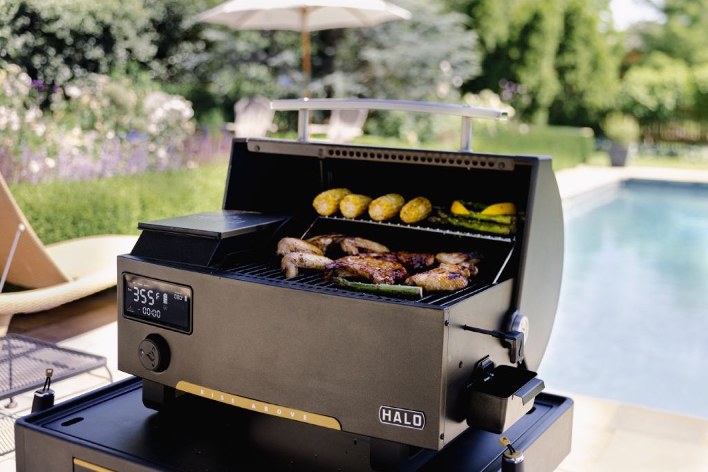 Pellet grill with meat and veggitables grilling