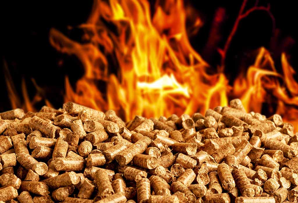 Burning wood pellets for pellet grill smoker